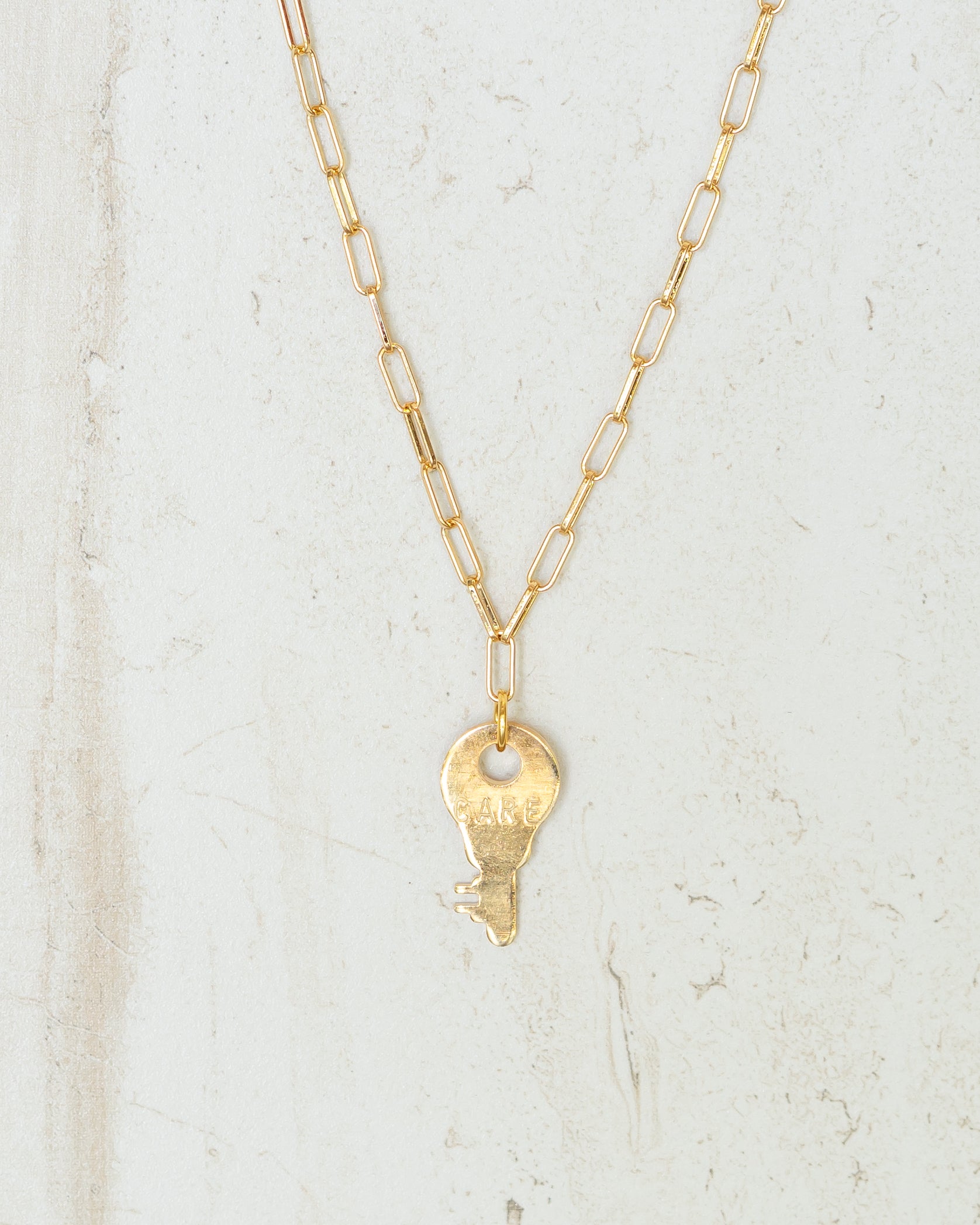 CARE Mini Giving Key Necklace