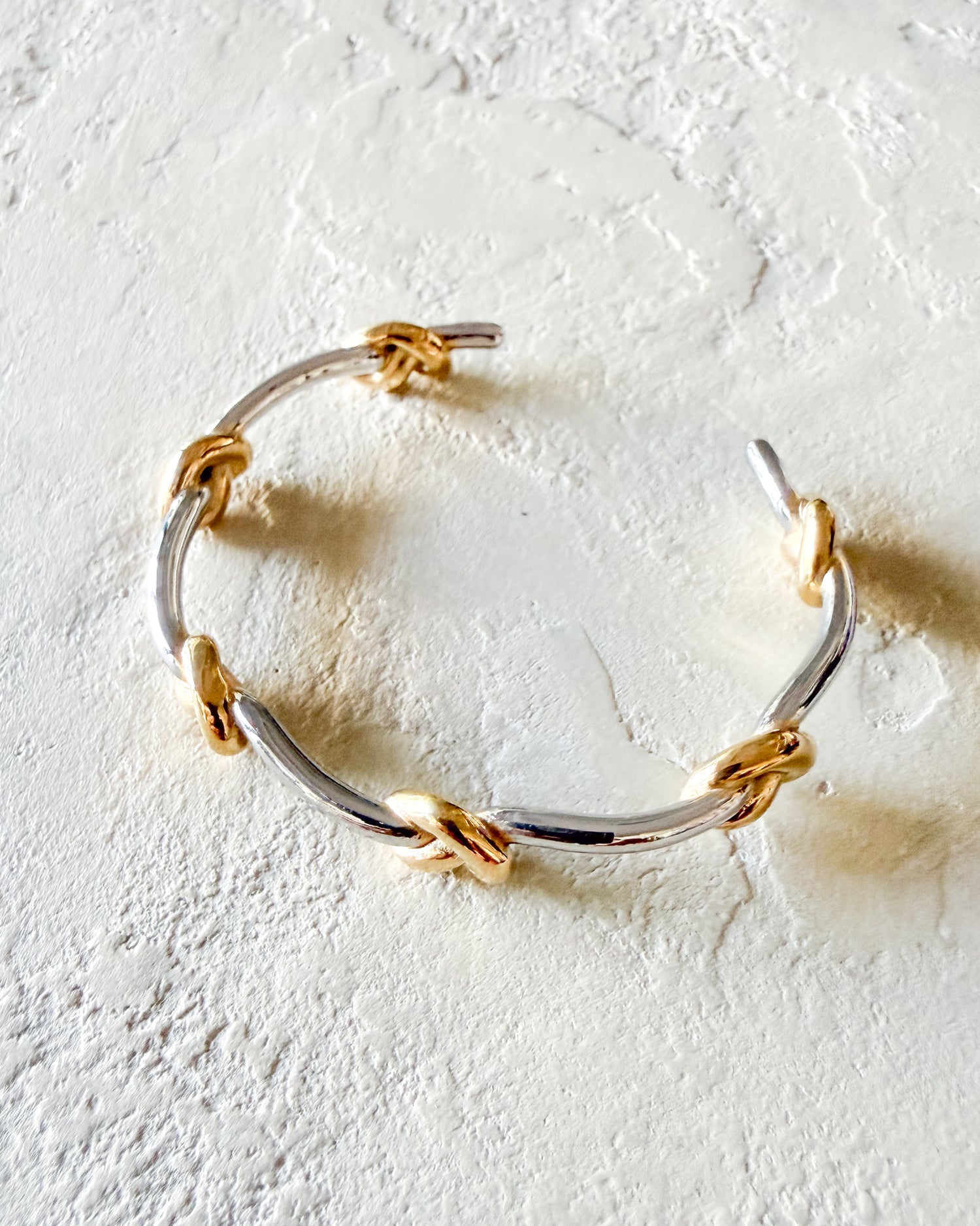Mixed metal knot bracelet