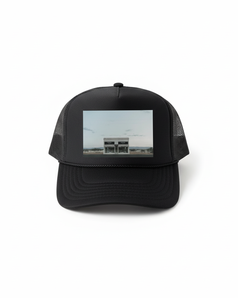 Black trucker hat flat lay